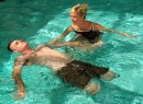 Lyn A. Boulanger, a therapist at Naval Medical Center San Diego, Calif., helps U.S. Marine Corps Staff Sgt. Jesse A. Cottle, a bilateral amputee, practice swimming during endurance training at the Comprehensive Combat and Complex Casualty Care (C5) facility pool in San Diego.
