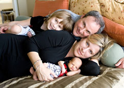 Keith Hoffman and his family - wife, Terri, and daughters Olivia (top) and Ava (bottom)